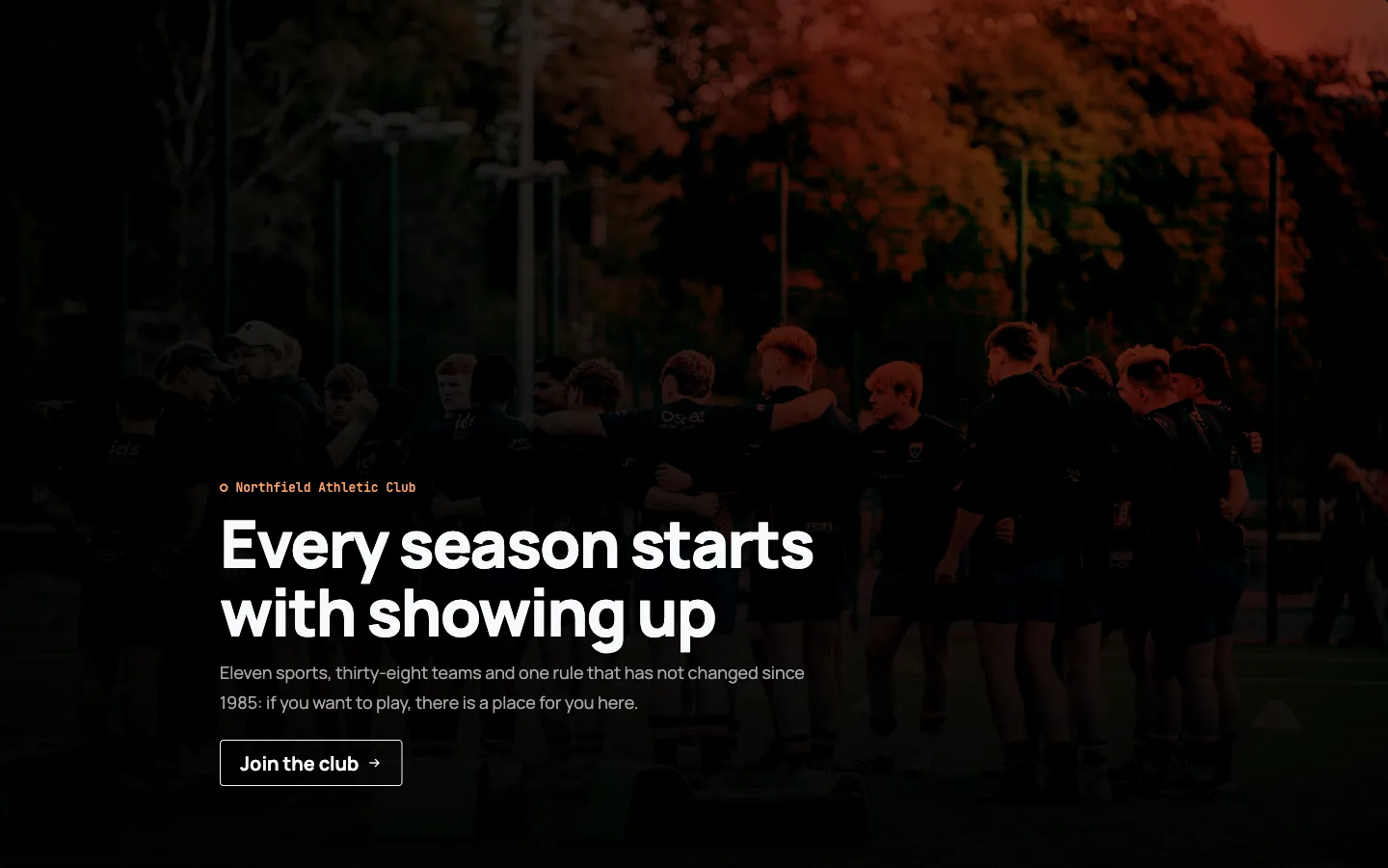 The same Hero Banner on a dark custom theme: photograph graded almost to silhouette, outline CTA